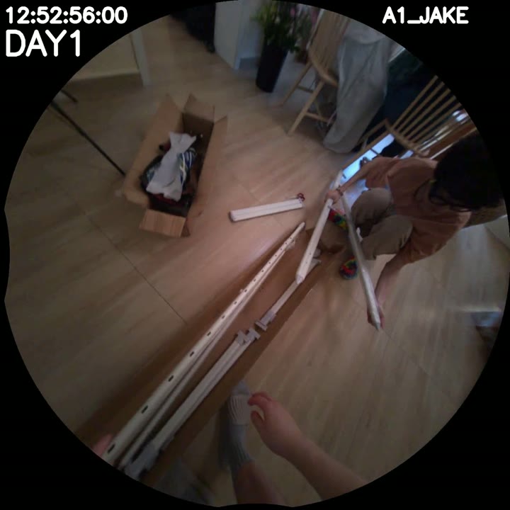Jake holds a pole near the packages at 12:52:56
